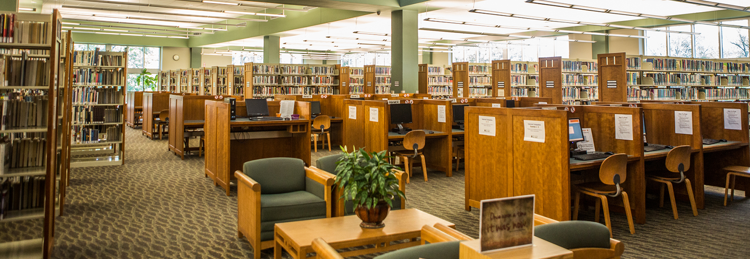 Interior shot of the library showing bookstacks and seating