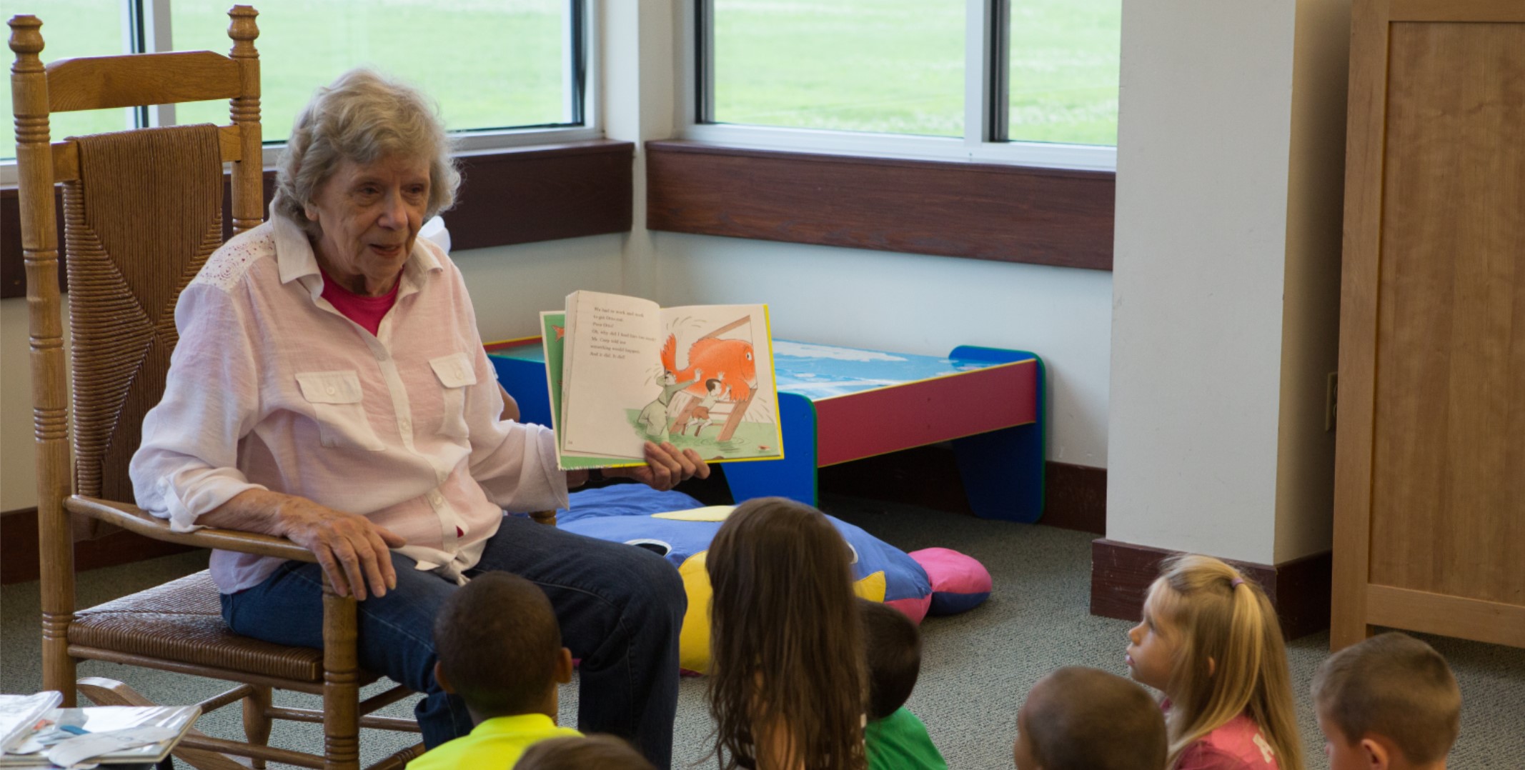 Woman reading to children during storytime at Windsor Drive Branch
