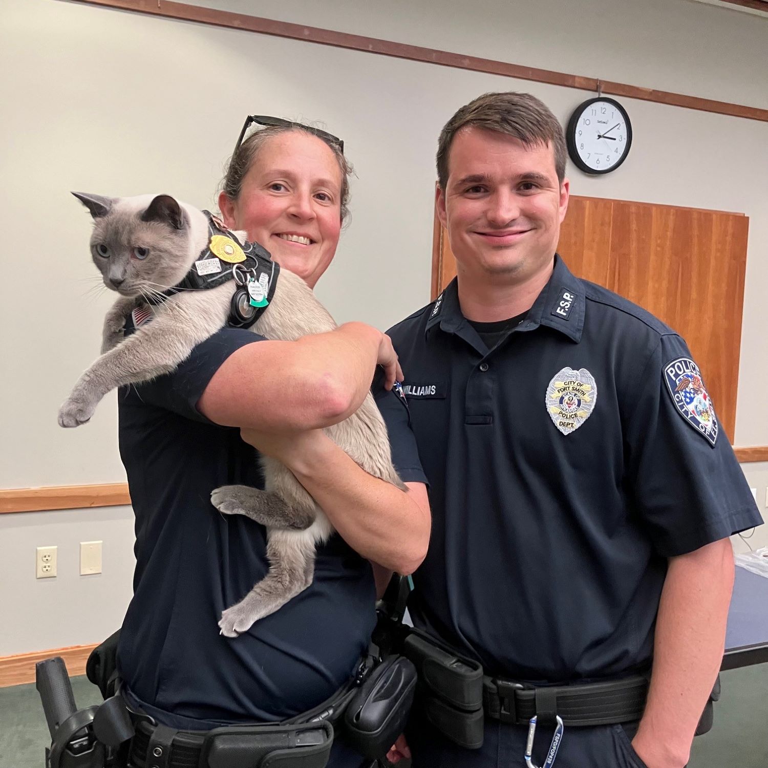 Officer Fuzz (cat) with FSPD officers