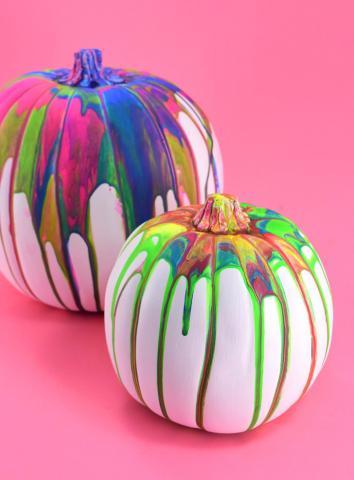 Pumpkins painted using a pour paint technique