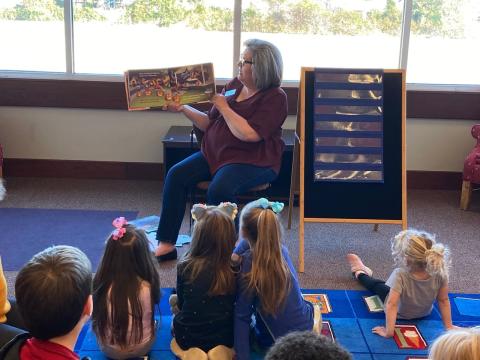 Mrs. Melanie reading at storytime